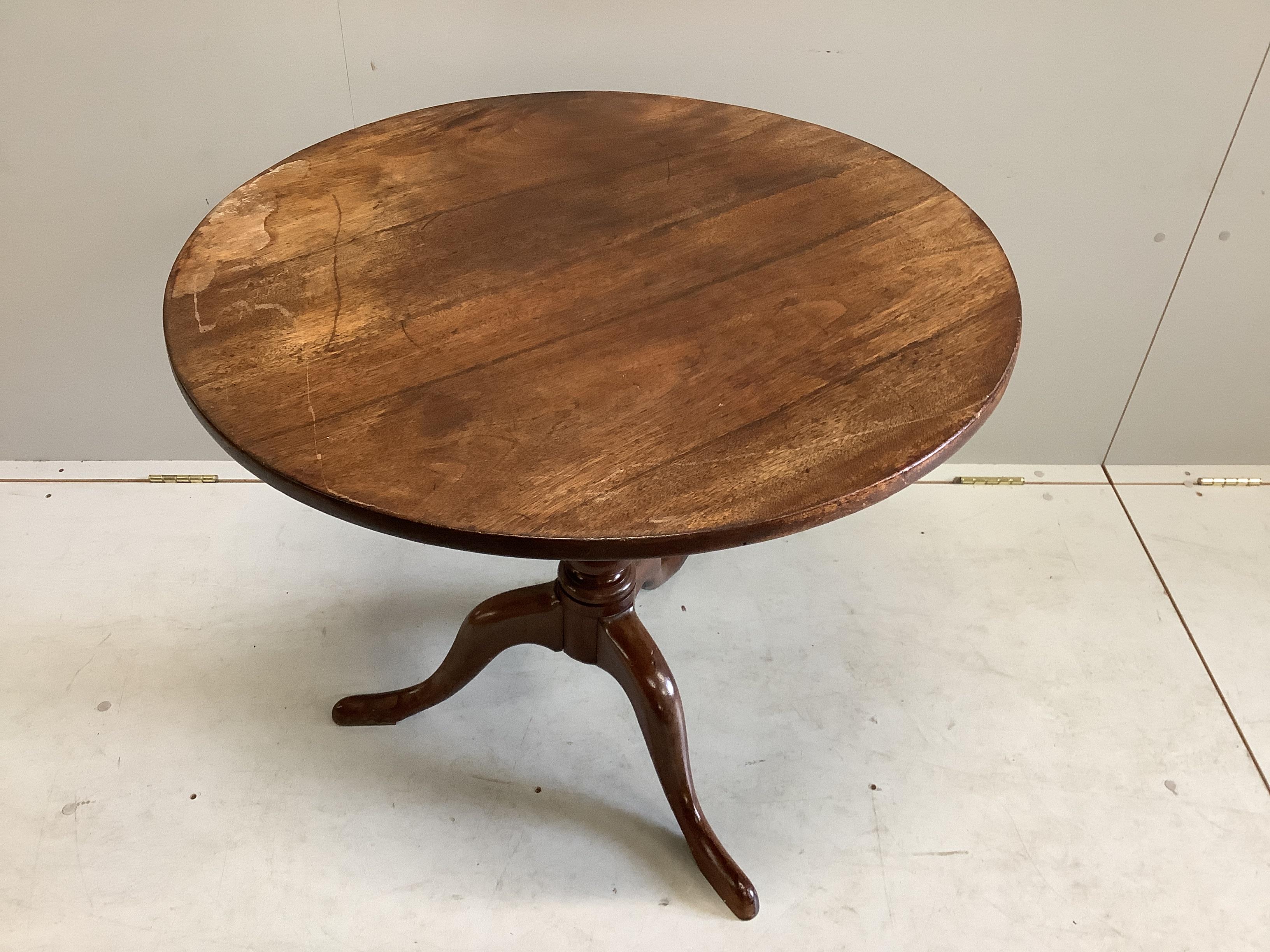 An early Victorian mahogany circular tilt top tripod tea table, diameter 80cm, height 71cm